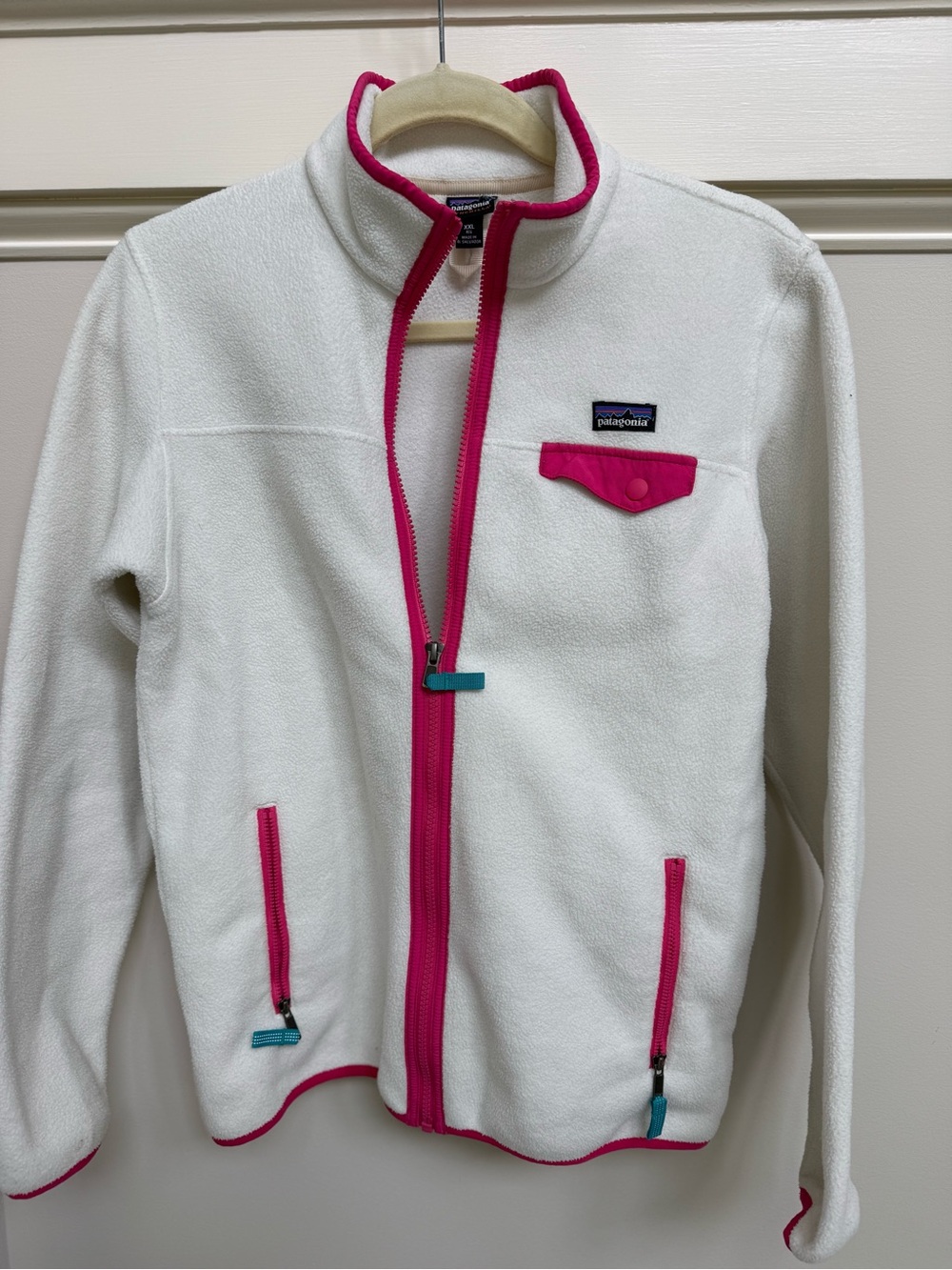 Patagonia Kids White Fleece Jacket with Pink Trim and Teal Zipper Pulls